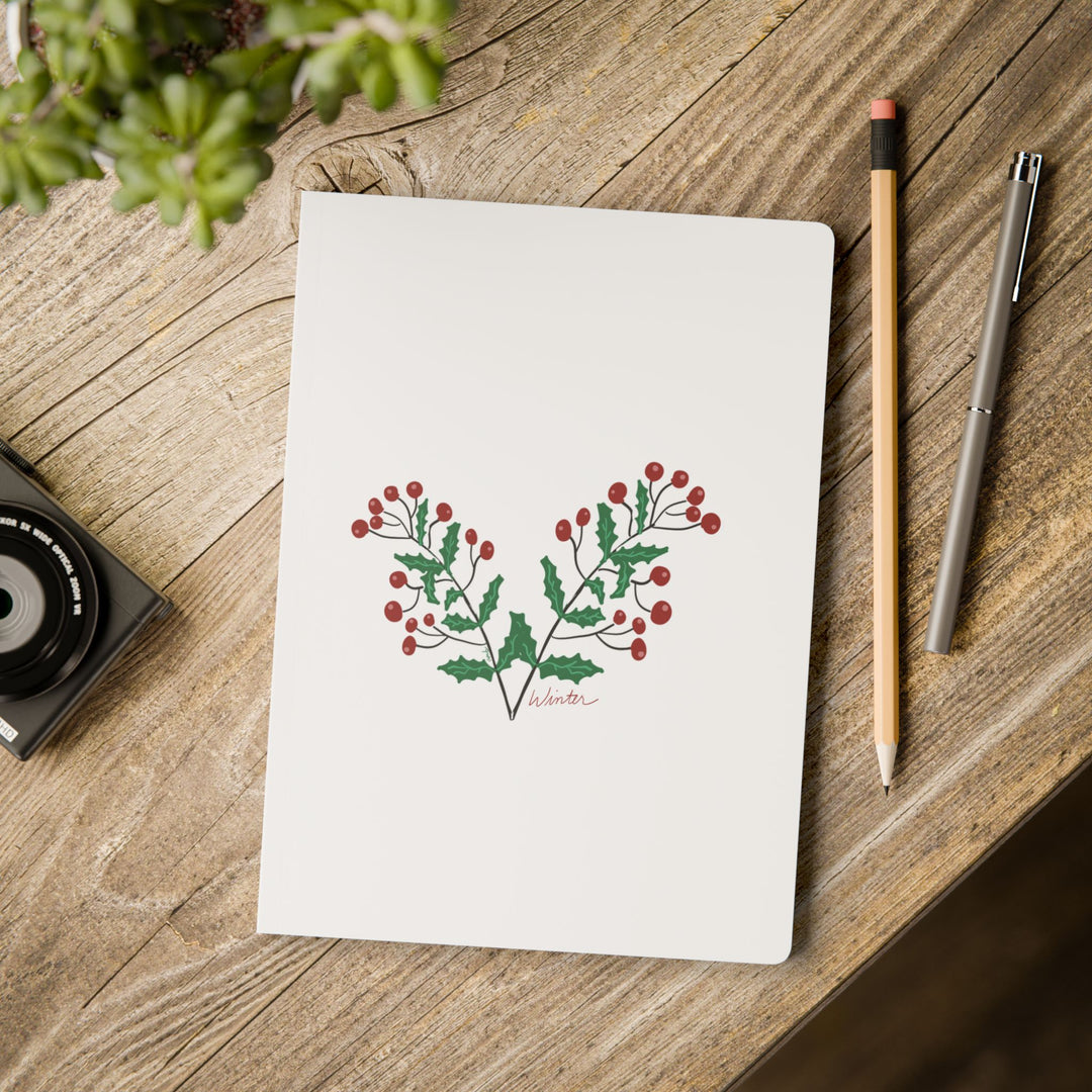 Desk scene with wood desk, pen, pencils and Winter journal from the Seasons collection by Annmarie Boyle